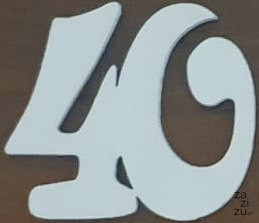 Cyfry drewniane białe ażurowe 5x5cm "40" 10szt. Cyfry drewniane białe ażurowe 5x5cm "40" 10szt.